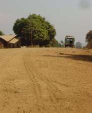 Off the beaten path. Land Cruiser taxi on dirt road in a remote corner of East Africa. Photographer: James Li, M.D.